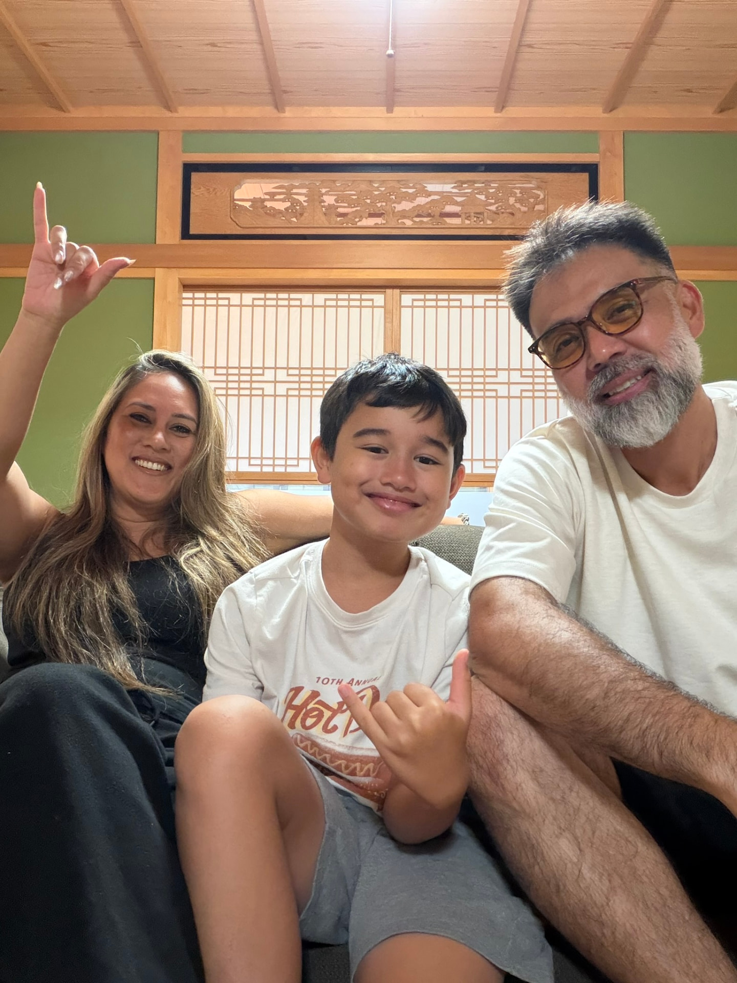 Brandy and family inside a traditional Japanese room throwing shakas
