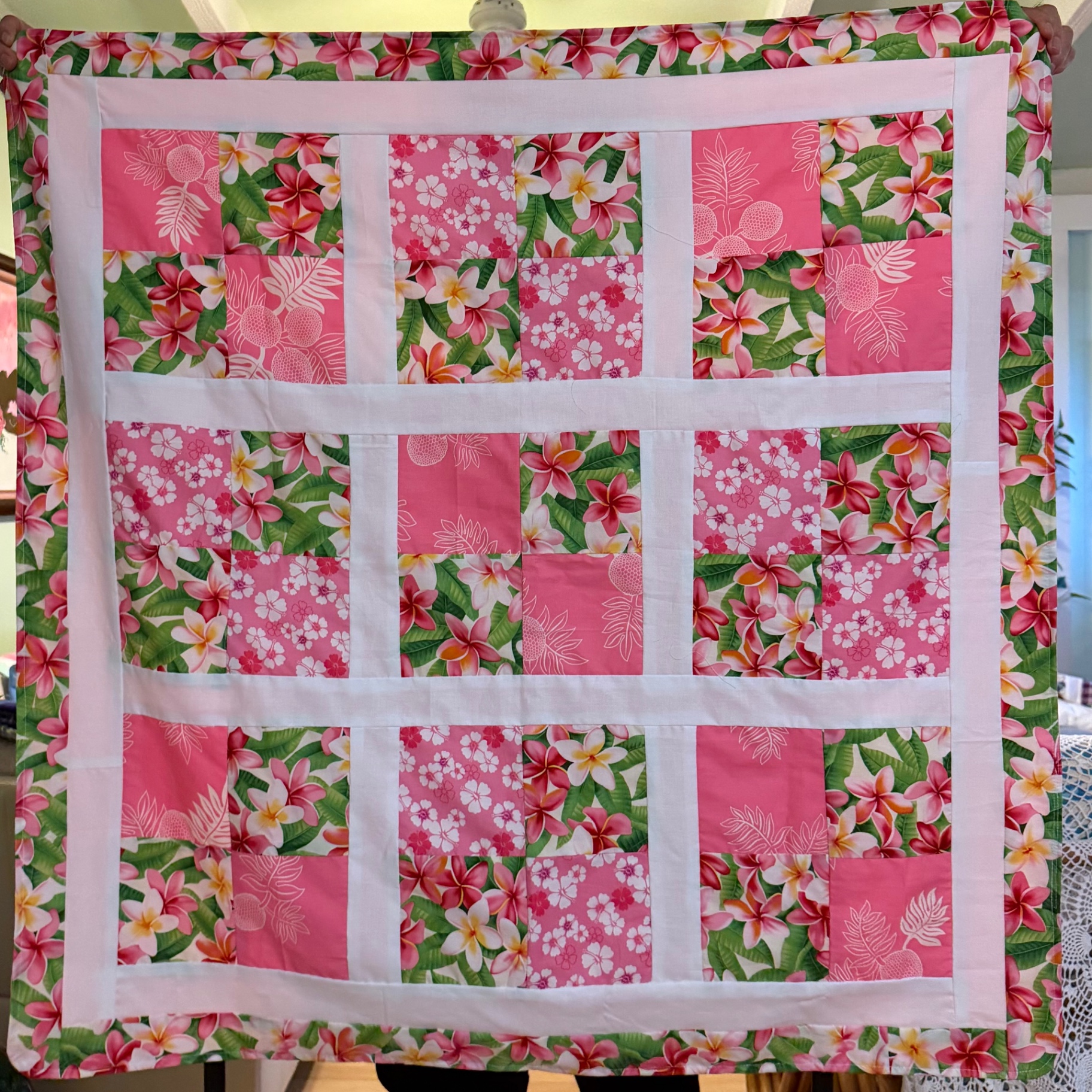 Pink and green plumeria-print Kīhei Pili summer blanket